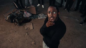 Movie still from “Kendrick Lamar - HUMBLE.” (2017), directed by Dave Meyers – Close Up shot, Over the shoulder angle