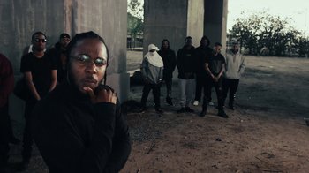 Movie still from “Kendrick Lamar - HUMBLE.” (2017), directed by Dave Meyers – Medium shot, Over the shoulder angle