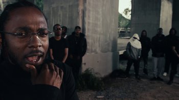 Movie still from “Kendrick Lamar - HUMBLE.” (2017), directed by Dave Meyers – Close Up shot, Over the shoulder angle