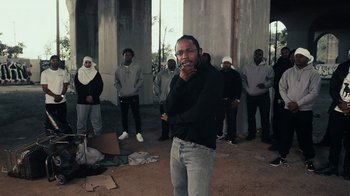 Movie still from “Kendrick Lamar - HUMBLE.” (2017), directed by Dave Meyers – Medium shot, Over the shoulder angle