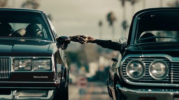 Movie still from “Kendrick Lamar - HUMBLE.” (2017), directed by Dave Meyers – Medium shot, Over the shoulder angle