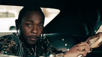 Movie still from “Kendrick Lamar - HUMBLE.” (2017), directed by Dave Meyers – Close Up shot, Over the shoulder angle