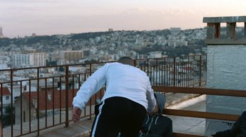 Movie still from “The Blaze - Territory” (2017), directed by The Blaze – Wide shot, Over the shoulder angle