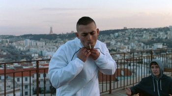 Movie still from “The Blaze - Territory” (2017), directed by The Blaze – Medium shot, Over the shoulder angle