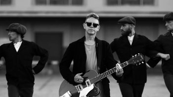 Movie still from “Depeche Mode - Where’s the Revolution” (2017), directed by Anton Corbijn – Medium shot, Low angle