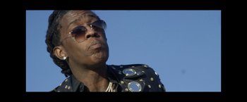 Movie still from “Young Thug - Wyclef Jean” (2017), directed by Ryan Staake – Close Up shot, Low angle