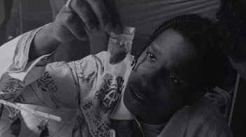 Movie still from “A$AP MOB - Moneyman” (2016), directed by Dexter Navy – Close Up shot, Overhead angle