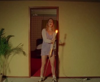 Movie still from “Off Bloom - Love to Hate It” (2016), directed by Nadia – Wide shot, Low angle