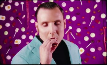 Movie still from “Two Door Cinema Club - Are We Ready” (2016), directed by Thunderlips – Close Up shot, Overhead angle