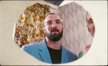 Movie still from “Two Door Cinema Club - Are We Ready” (2016), directed by Thunderlips – Medium shot, Overhead angle