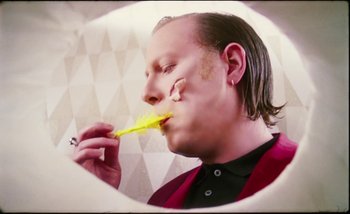 Movie still from “Two Door Cinema Club - Are We Ready” (2016), directed by Thunderlips – Close Up shot, Overhead angle