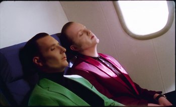Movie still from “Two Door Cinema Club - Are We Ready” (2016), directed by Thunderlips – Close Up shot, Overhead angle