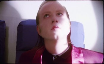 Movie still from “Two Door Cinema Club - Are We Ready” (2016), directed by Thunderlips – Close Up shot, Low angle