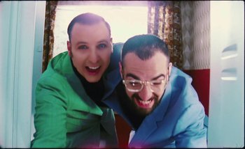 Movie still from “Two Door Cinema Club - Are We Ready” (2016), directed by Thunderlips – Close Up shot, Overhead angle