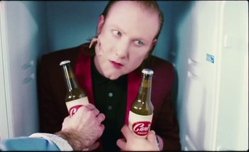 Movie still from “Two Door Cinema Club - Are We Ready” (2016), directed by Thunderlips – Close Up shot, Over the shoulder angle