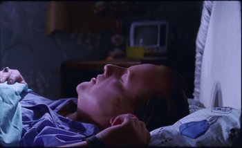 Movie still from “Two Door Cinema Club - Are We Ready” (2016), directed by Thunderlips – Close Up shot, High angle