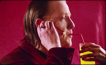 Movie still from “Two Door Cinema Club - Are We Ready” (2016), directed by Thunderlips – Close Up shot, High angle