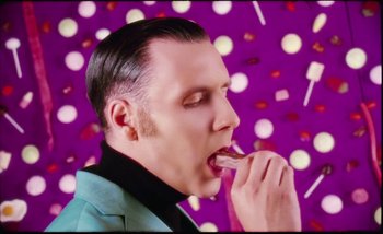 Movie still from “Two Door Cinema Club - Are We Ready” (2016), directed by Thunderlips – Close Up shot, Overhead angle