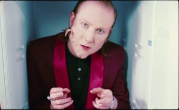 Movie still from “Two Door Cinema Club - Are We Ready” (2016), directed by Thunderlips – Close Up shot, Low angle