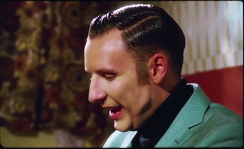 Movie still from “Two Door Cinema Club - Are We Ready” (2016), directed by Thunderlips – Close Up shot, Low angle