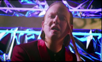 Movie still from “Two Door Cinema Club - Are We Ready” (2016), directed by Thunderlips – Close Up shot, Low angle