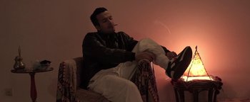 Movie still from “The Blaze - Virile” (2016), directed by The Blaze – Medium shot, Low angle