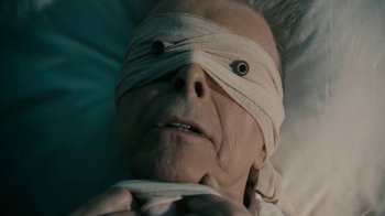 Movie still from “David Bowie - Lazarus” (2016), directed by Johan Renck – Close Up shot, Overhead angle