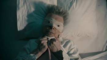 Movie still from “David Bowie - Lazarus” (2016), directed by Johan Renck – Close Up shot, Overhead angle