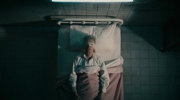 Movie still from “David Bowie - Lazarus” (2016), directed by Johan Renck – Medium shot, Overhead angle