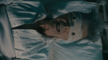 Movie still from “David Bowie - Lazarus” (2016), directed by Johan Renck – Close Up shot, Overhead angle