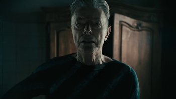 Movie still from “David Bowie - Lazarus” (2016), directed by Johan Renck – Close Up shot, Low angle