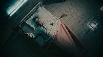 Movie still from “David Bowie - Lazarus” (2016), directed by Johan Renck – Medium shot, Overhead angle