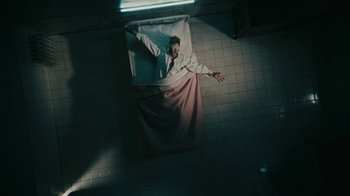 Movie still from “David Bowie - Lazarus” (2016), directed by Johan Renck – Wide shot, Overhead angle