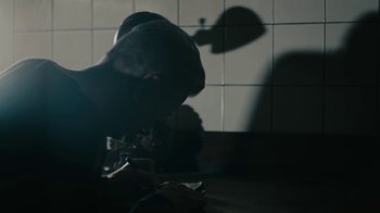 Movie still from “David Bowie - Lazarus” (2016), directed by Johan Renck – Medium shot, Low angle