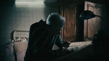 Movie still from “David Bowie - Lazarus” (2016), directed by Johan Renck – Medium shot, High angle