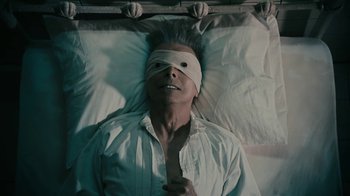 Movie still from “David Bowie - Lazarus” (2016), directed by Johan Renck – Close Up shot, Overhead angle