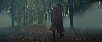 Movie still from “Travis Scott & Kanye West - Piss on your Grave” (2015), directed by Nabil Elderkin – Wide shot, Low angle