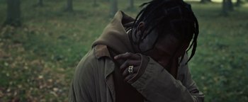 Movie still from “Travis Scott & Kanye West - Piss on your Grave” (2015), directed by Nabil Elderkin – Close Up shot, Over the shoulder angle