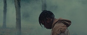 Movie still from “Travis Scott & Kanye West - Piss on your Grave” (2015), directed by Nabil Elderkin – Close Up shot, Low angle