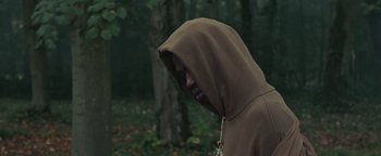 Movie still from “Travis Scott & Kanye West - Piss on your Grave” (2015), directed by Nabil Elderkin – Close Up shot, Low angle