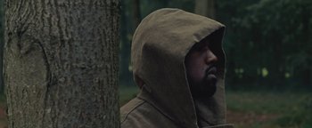 Movie still from “Travis Scott & Kanye West - Piss on your Grave” (2015), directed by Nabil Elderkin – Close Up shot, Over the shoulder angle