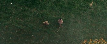 Movie still from “Travis Scott & Kanye West - Piss on your Grave” (2015), directed by Nabil Elderkin – Extreme Wide shot, Overhead angle