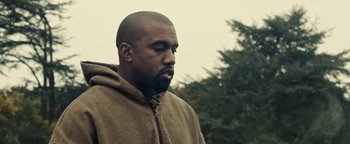 Movie still from “Travis Scott & Kanye West - Piss on your Grave” (2015), directed by Nabil Elderkin – Close Up shot, Low angle