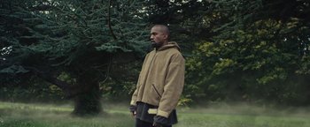 Movie still from “Travis Scott & Kanye West - Piss on your Grave” (2015), directed by Nabil Elderkin – Medium shot, Over the shoulder angle