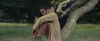 Movie still from “Travis Scott & Kanye West - Piss on your Grave” (2015), directed by Nabil Elderkin – Medium shot, Low angle