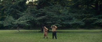 Movie still from “Travis Scott & Kanye West - Piss on your Grave” (2015), directed by Nabil Elderkin – Wide shot, Low angle