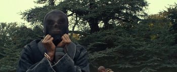 Movie still from “Travis Scott & Kanye West - Piss on your Grave” (2015), directed by Nabil Elderkin – Close Up shot, Low angle