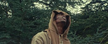 Movie still from “Travis Scott & Kanye West - Piss on your Grave” (2015), directed by Nabil Elderkin – Close Up shot, Low angle