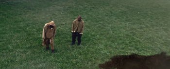 Movie still from “Travis Scott & Kanye West - Piss on your Grave” (2015), directed by Nabil Elderkin – Wide shot, High angle