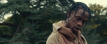 Movie still from “Travis Scott & Kanye West - Piss on your Grave” (2015), directed by Nabil Elderkin – Close Up shot, Low angle